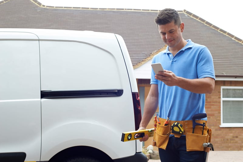 technician holding phone